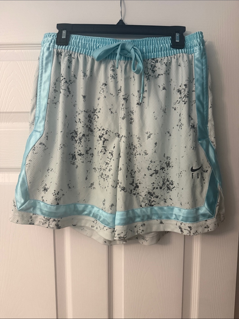 Nike Women’s White Athletic Shorts with Light Blue Trim and Black Speckle
